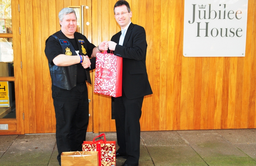 Jeremy Wright handing over donations of toiletries